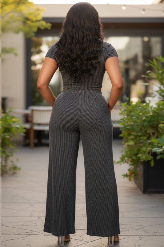 Female model wearing the Olivia Pant Set in Charcoal, showcasing the back view of the fitted crop top and wide-leg pants.