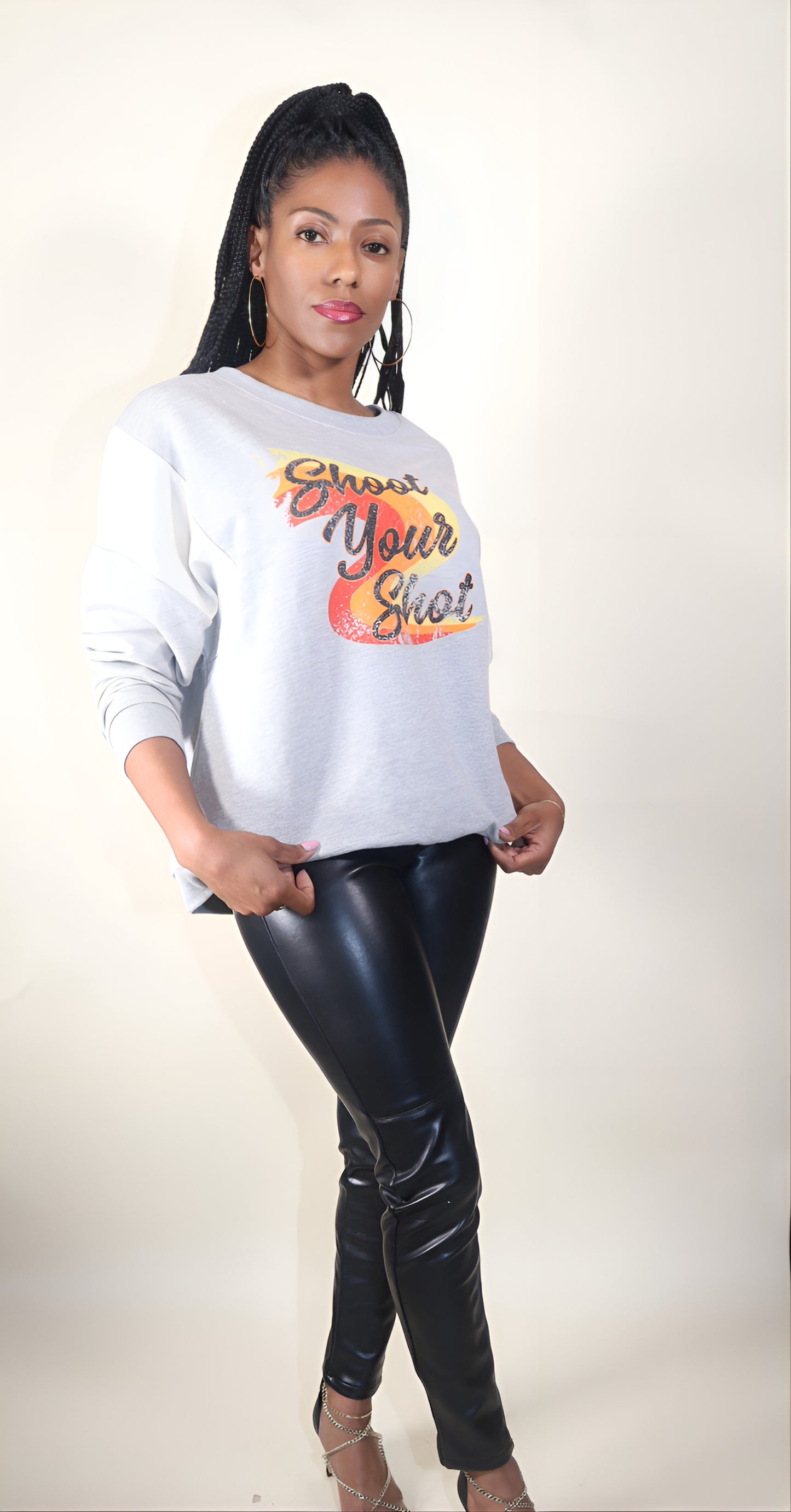 Heather grey Vintage-style Shoot Your Shot text graphic print Round neckline Long batwing sleeves Dropped shoulder Ribbed neckline, cuffs, and hem Loose fit 94% Cotton 4% Polyester 2% Spandex Color may vary due to lighting on image