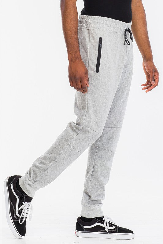 Indulge in comfort with TONY JOGGERS for men. Perfect fit, adjustable drawstring, zippered pocket, and elastic ankle cuff. Designed with a luxurious blend of cotton, polyester, and spandex for comfort and durability.