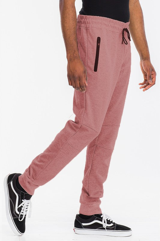 Indulge in comfort with TONY JOGGERS for men. Perfect fit, adjustable drawstring, zippered pocket, and elastic ankle cuff. Designed with a luxurious blend of cotton, polyester, and spandex for comfort and durability.