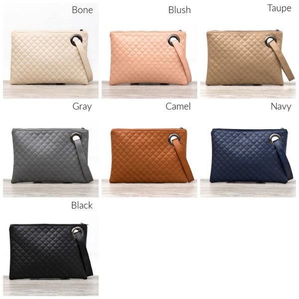 Premium soft quilted PU leather exterior Cotton Herringbone print lining Measures 11.75" x 8.5" Interior Credit Card Deck 2 Open Interior Pockets Attached Wristlet Grommet Detail Color may vary due to lighting on image OneSize: null (Length), null (Width), null (Height)