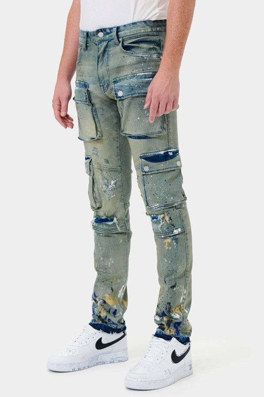 Complete with button and hidden-fly fastening, this premium denim features a five-pocket design with four additional cargo pockets on the front and side. The slim straight leg fit is adorned with painted accents and complemented by belt loops, rivets, and a branded back patch. A light sand tint adds to the sophisticated and exclusive appeal, while the 32" inseam length is suitable for all sizes. Perfect for a casual yet elevated look, this distressed style exudes elegance and taste.