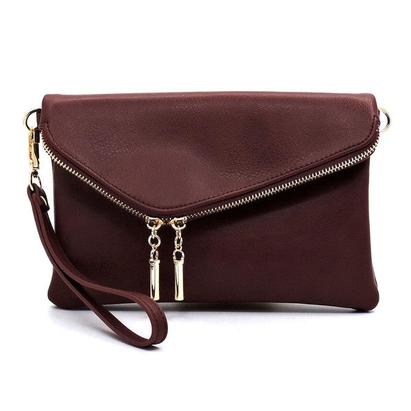 Cranberry fold-over clutch purse accented with gold tone hardware.
