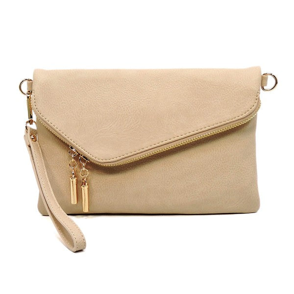 Nude fold-over clutch purse accented with gold tone hardware.