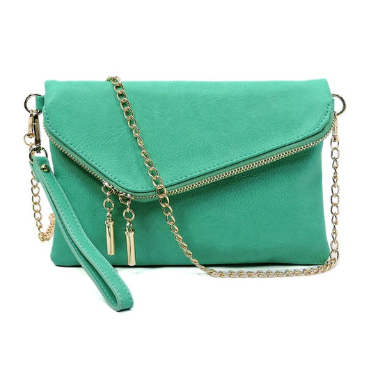 Turquoise fold-over clutch purse accented with gold tone hardware.