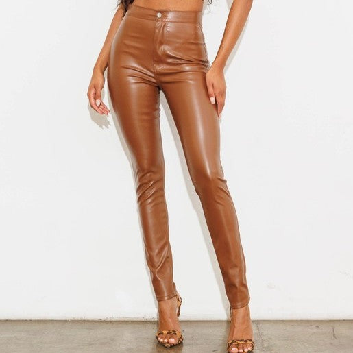 Elevate your style with our chic, sophisticated FLORIDA VEGAN LEATHER PANT. This sleek silhouette features a sleek skinny fit, accented by eye-catching pockets and a timeless zip fly closure. Designed with a long, flattering length and crafted from luxurious vegan leather, these pants exude elegance and exclusivity. No lining necessary – our premium vegan leather speaks for itself.