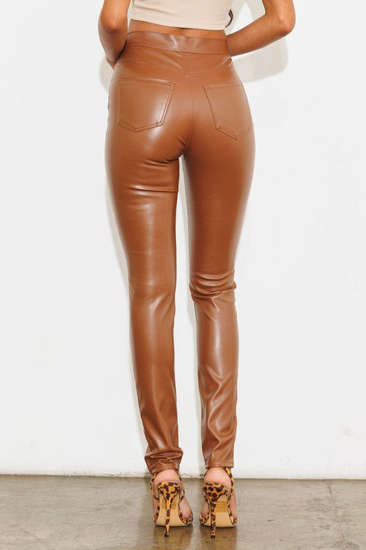 Elevate your style with our chic, sophisticated FLORIDA VEGAN LEATHER PANT. This sleek silhouette features a sleek skinny fit, accented by eye-catching pockets and a timeless zip fly closure. Designed with a long, flattering length and crafted from luxurious vegan leather, these pants exude elegance and exclusivity. No lining necessary – our premium vegan leather speaks for itself.