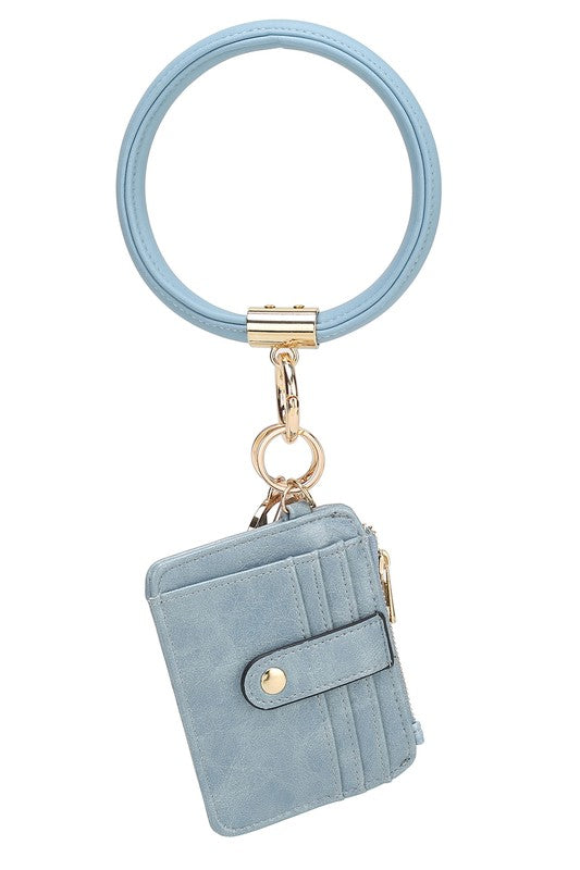 Introducing the MARIE VEGAN LEATHER KEYCHAIN – a stylish and practical accessory that combines a bracelet, credit card holder, and gold-tone hardware. Compact and versatile with a zipper and snap closure, upgrade your keychain game with MARIE!