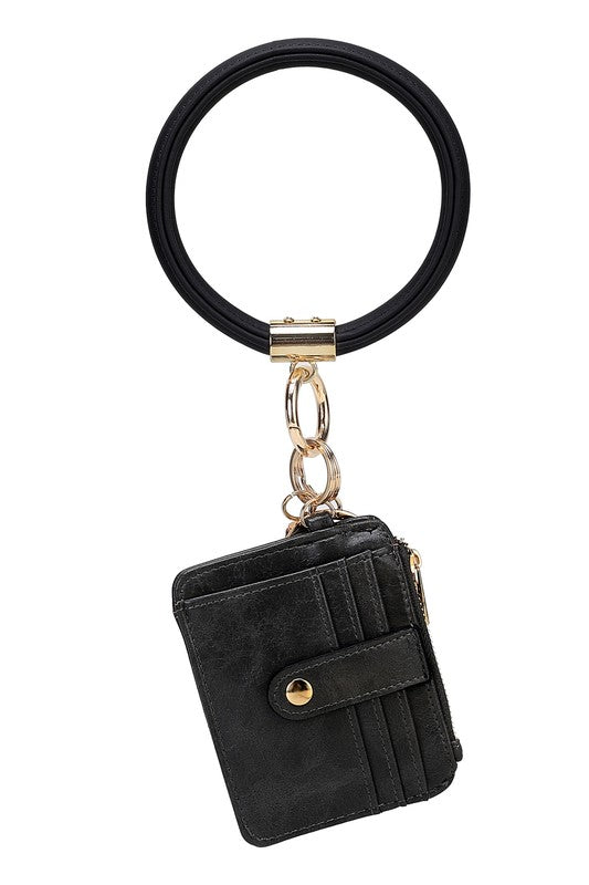 Introducing the MARIE VEGAN LEATHER KEYCHAIN – a stylish and practical accessory that combines a bracelet, credit card holder, and gold-tone hardware. Compact and versatile with a zipper and snap closure, upgrade your keychain game with MARIE!