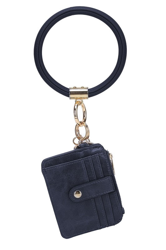 Introducing the MARIE VEGAN LEATHER KEYCHAIN – a stylish and practical accessory that combines a bracelet, credit card holder, and gold-tone hardware. Compact and versatile with a zipper and snap closure, upgrade your keychain game with MARIE!