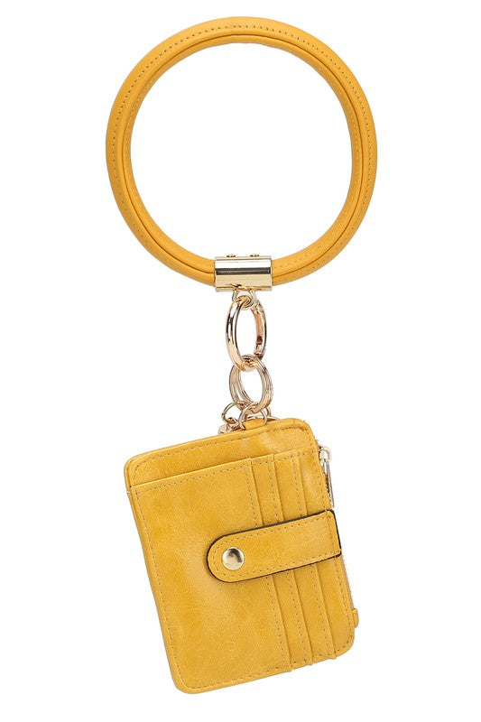 Introducing the MARIE VEGAN LEATHER KEYCHAIN – a stylish and practical accessory that combines a bracelet, credit card holder, and gold-tone hardware. Compact and versatile with a zipper and snap closure, upgrade your keychain game with MARIE!