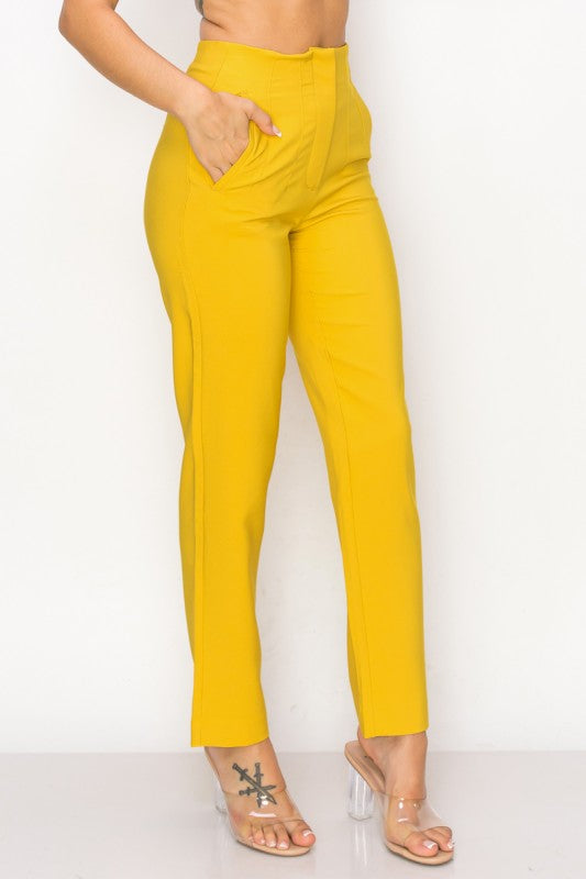 Yellow pants worn by a person on a white background