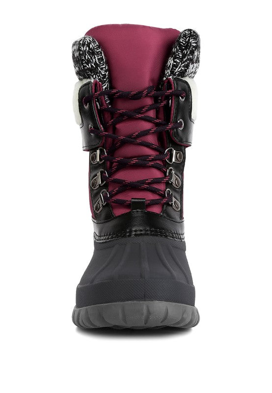 Crafted with a faux leather upper material, these boots feature a TPR outer sole and a closed rounded toe for lasting durability and endless comfort. The lace up closure allows for a secure fit while the knitted collar adds a touch of style. Designed with shearling lining detail and a lug sole, and finished with lightly cushioned insoles, these boots are perfect for any occasion. 