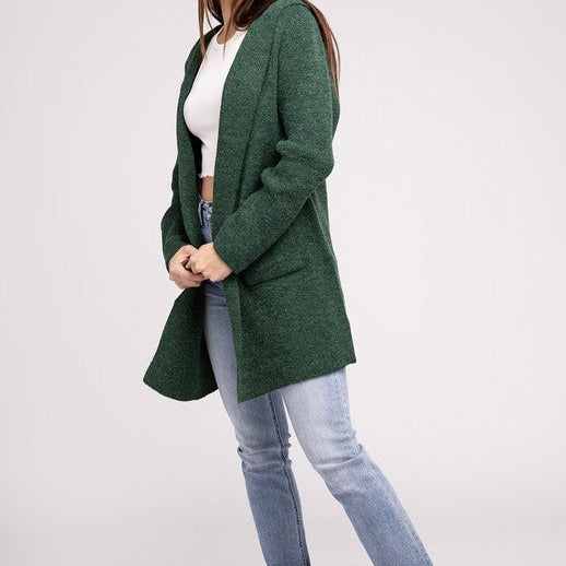 Hooded Open Front Sweater Cardigan, the perfect combination of comfort and fashion. Made with a soft and cozy knit, this cardigan has an open front for easy layering. The attached hood adds casual sophistication, and the front pockets add style and convenience.