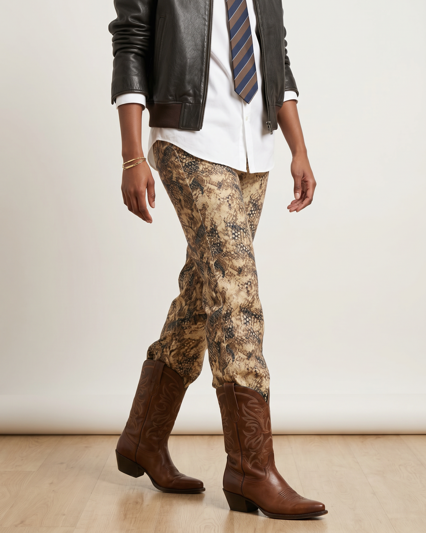 Model wearing Bambi Cowgirl Wide Leg Jeans with brown cowboy boots, showcasing the western-inspired print and versatile styling.
