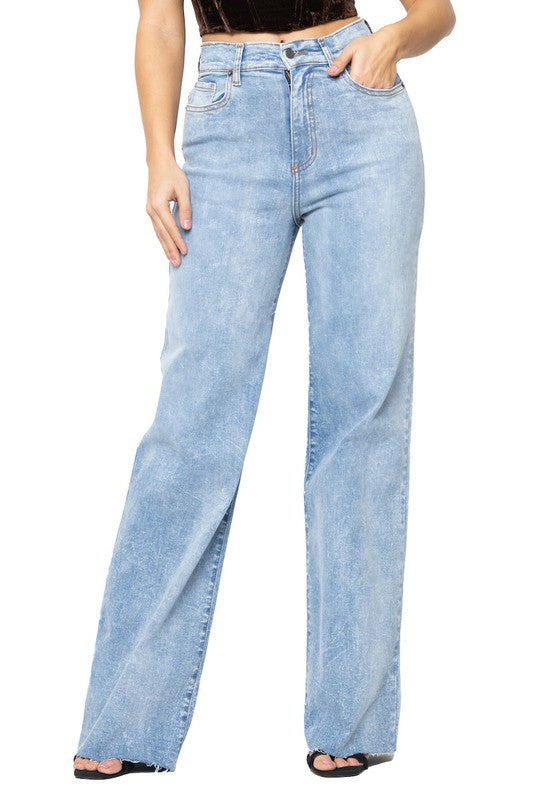 Light blue jeans worn by a womam on a white background