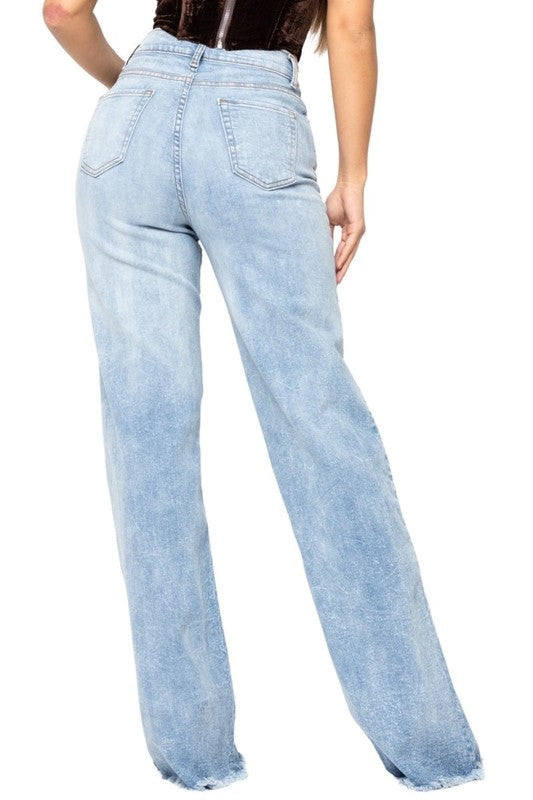 Light blue jeans worn by a person on a white background