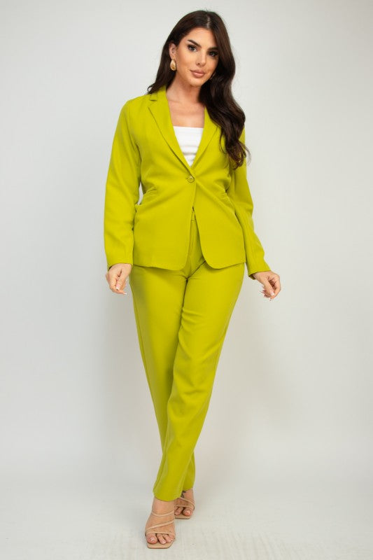 Woman wearing a bright green suit on a white background