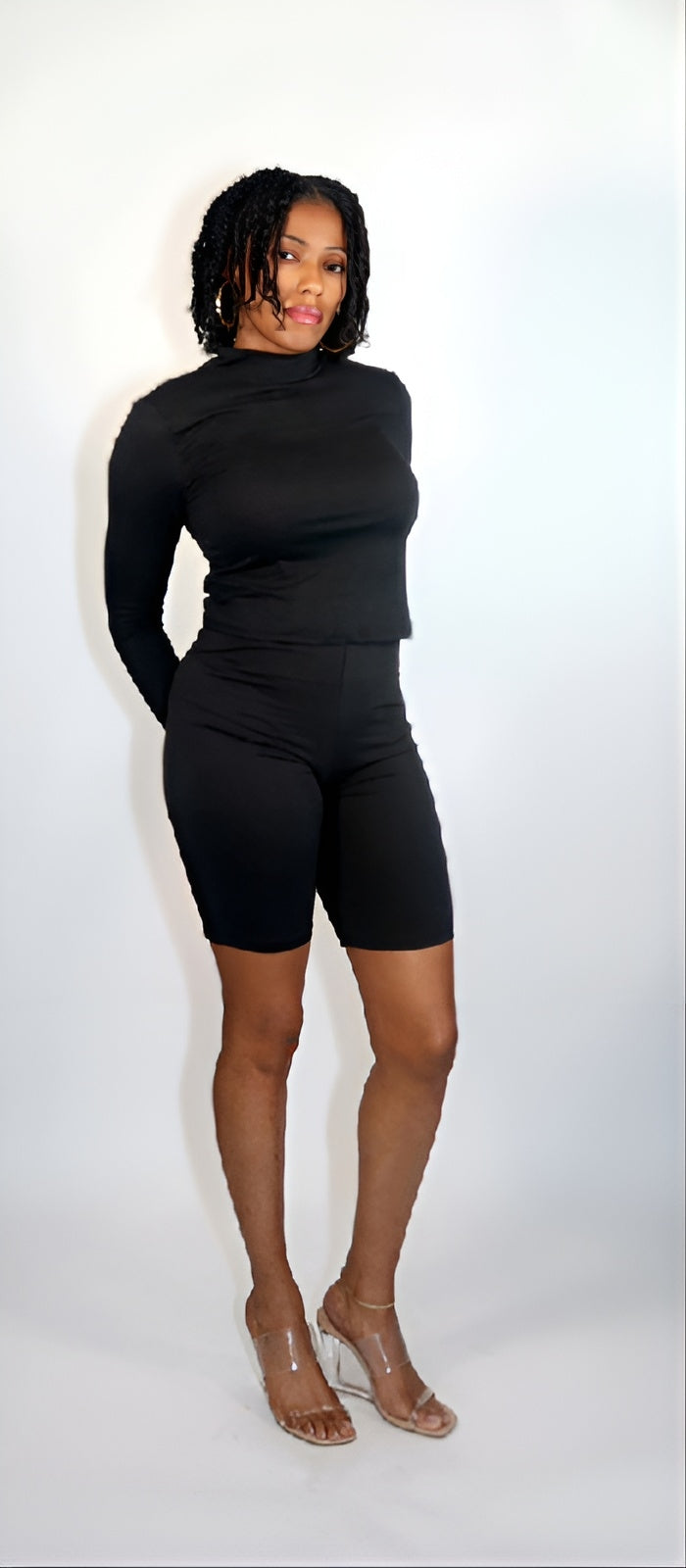 Constructed from a stretch knit fabric, this LITHA BIKER SHORT SET includes a Solid Mock neck top and Biker shorts, made from a blend of 92% Polyester and 8% Spandex. These pieces are ideal for comfortable loungewear, providing both stretch and softness for ultimate relaxation.