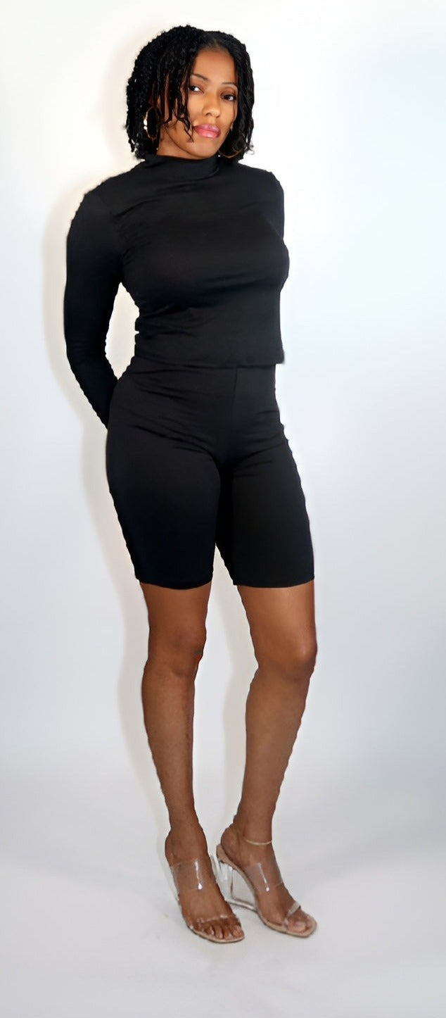 Constructed from a stretch knit fabric, this LITHA BIKER SHORT SET includes a Solid Mock neck top and Biker shorts, made from a blend of 92% Polyester and 8% Spandex. These pieces are ideal for comfortable loungewear, providing both stretch and softness for ultimate relaxation.