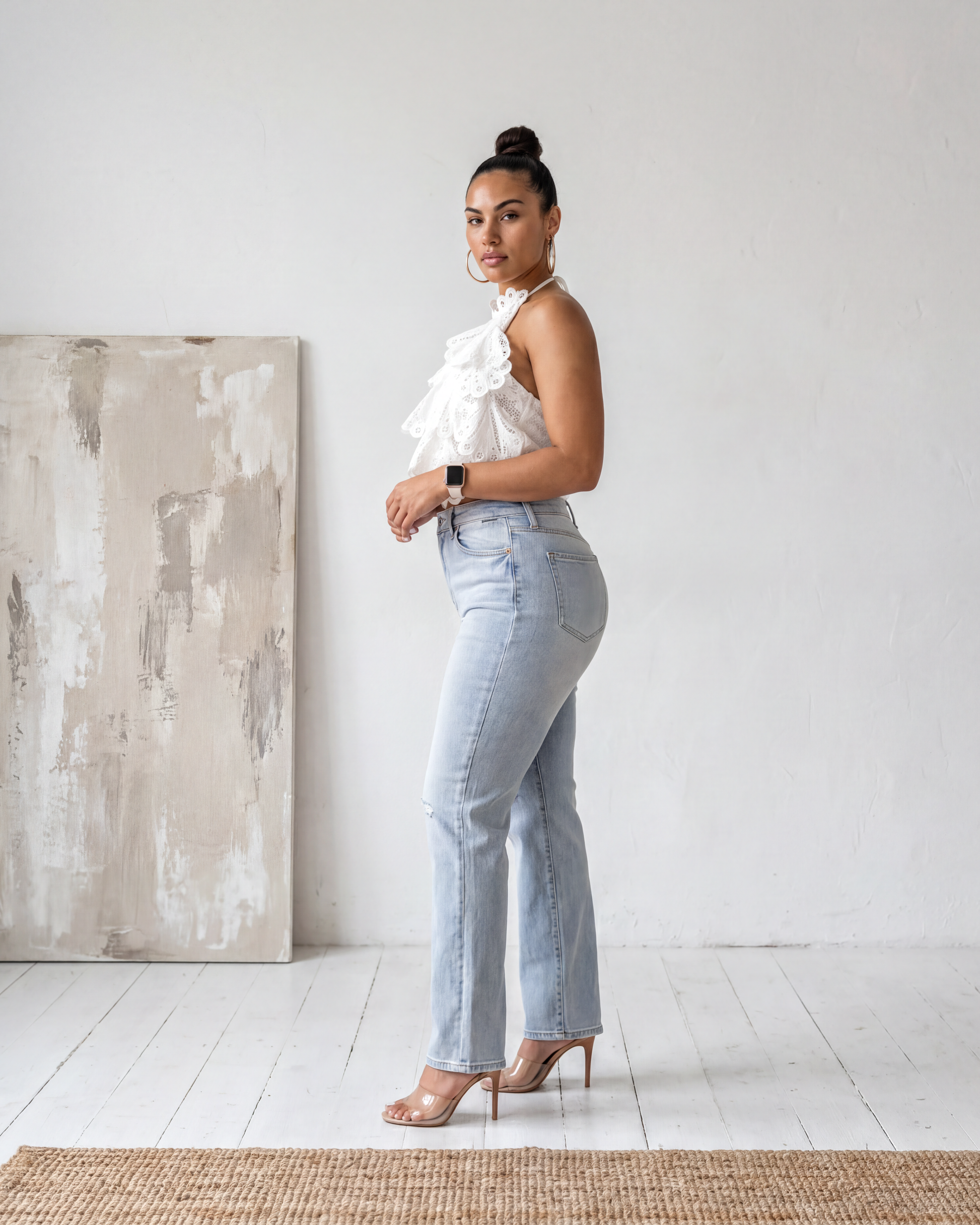 Side profile view of the Madison Distressed Straight Denim Jean in a light wash featuring distressed knees and a relaxed straight-leg fit.