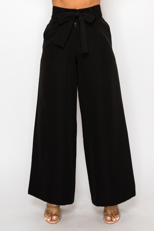 Black wide-leg pants with a bow detail on a white background