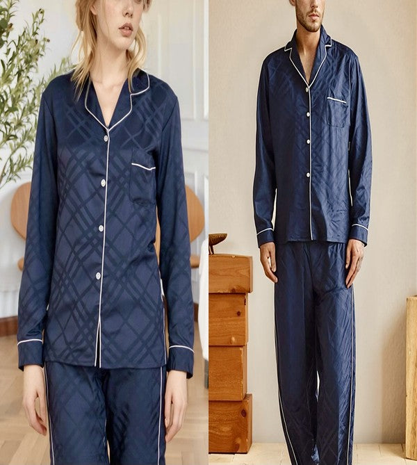 Navy blue pajama set with white accents worn by a model indoors.