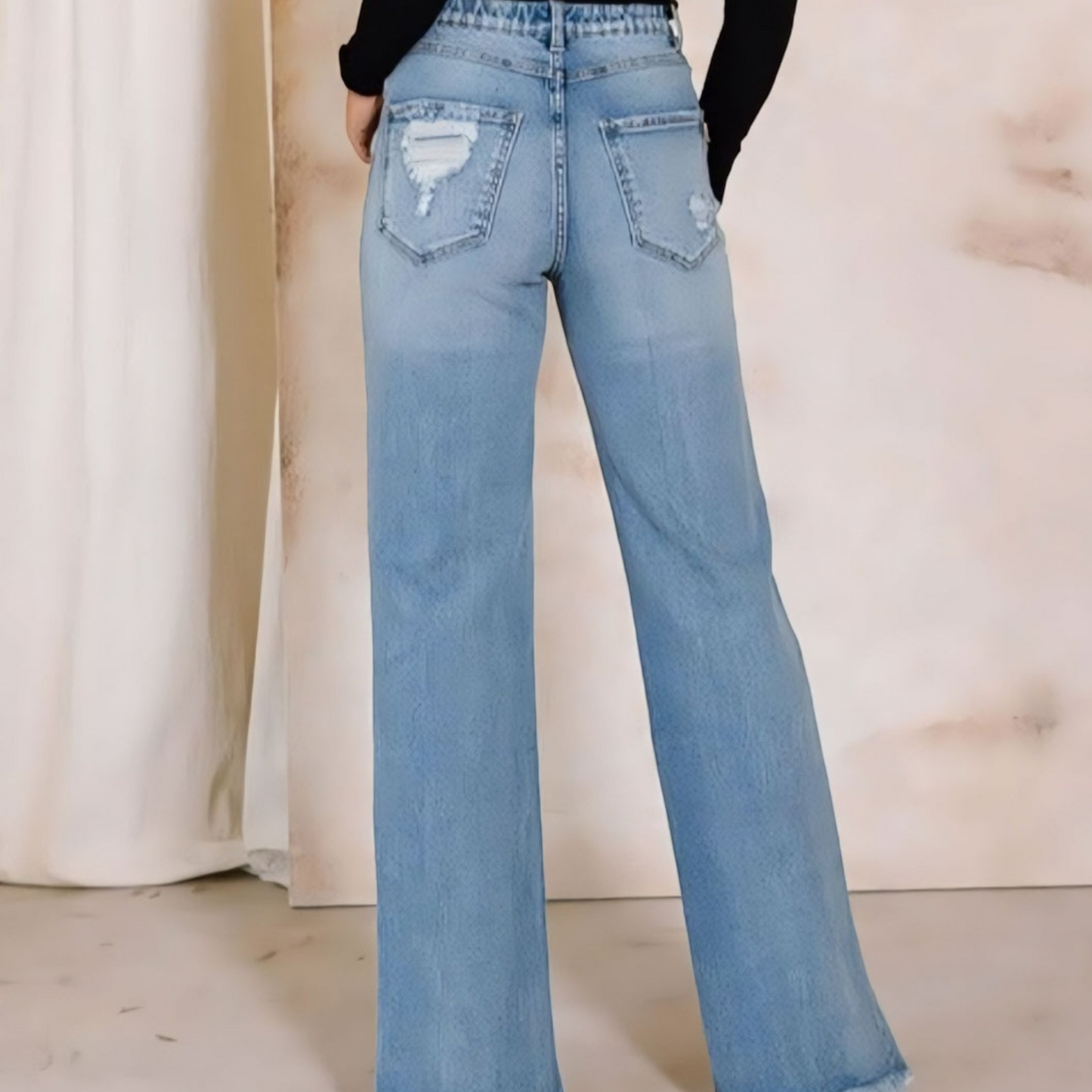 Elevate your denim collection with our High Rise Distressed Wide Jeans. Get the best of both worlds - comfort and style - with these flexible yet authentic denim pants. The high-rise design cinches at the waist for a flattering fit.