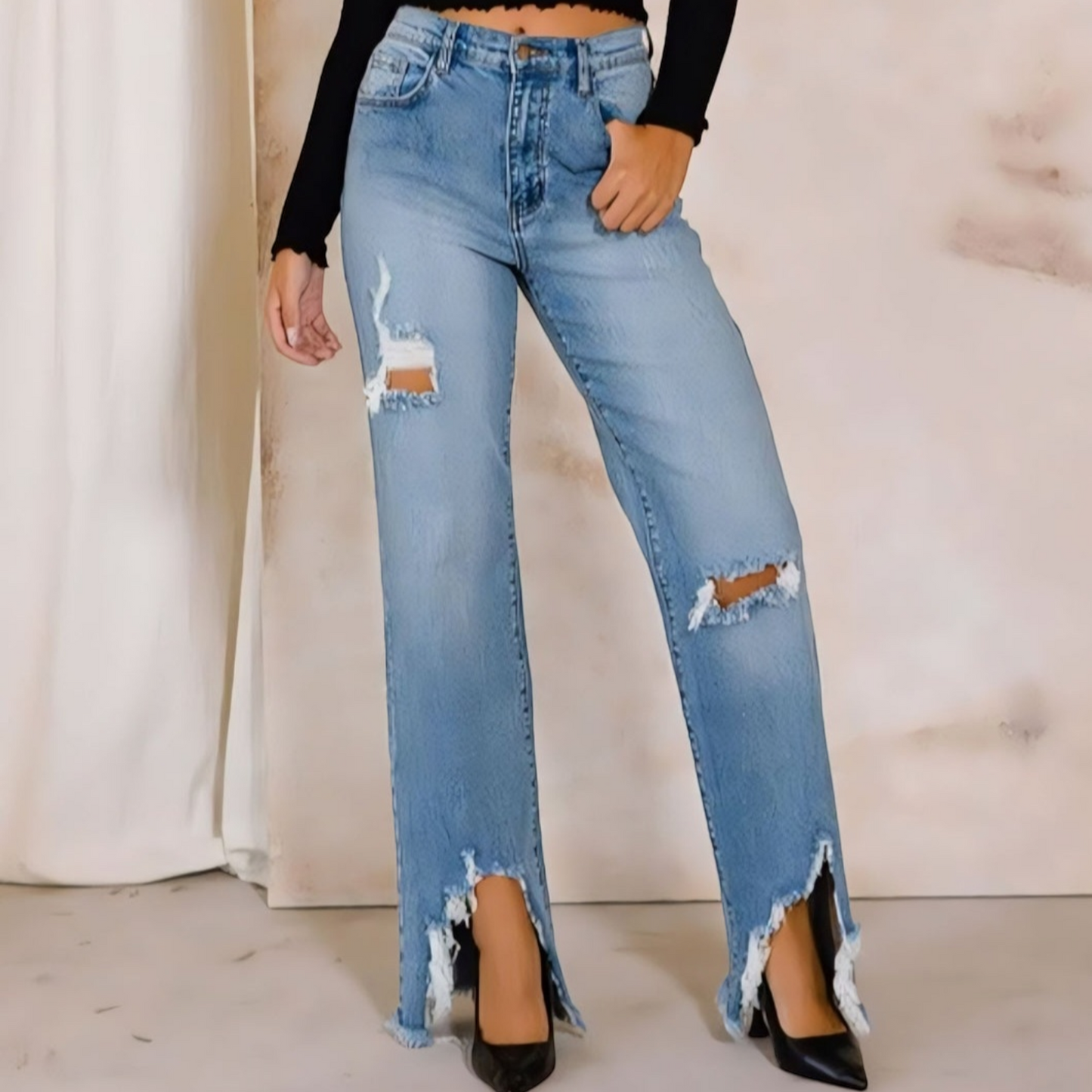 Elevate your denim collection with our High Rise Distressed Wide Jeans. Get the best of both worlds - comfort and style - with these flexible yet authentic denim pants. The high-rise design cinches at the waist for a flattering fit.