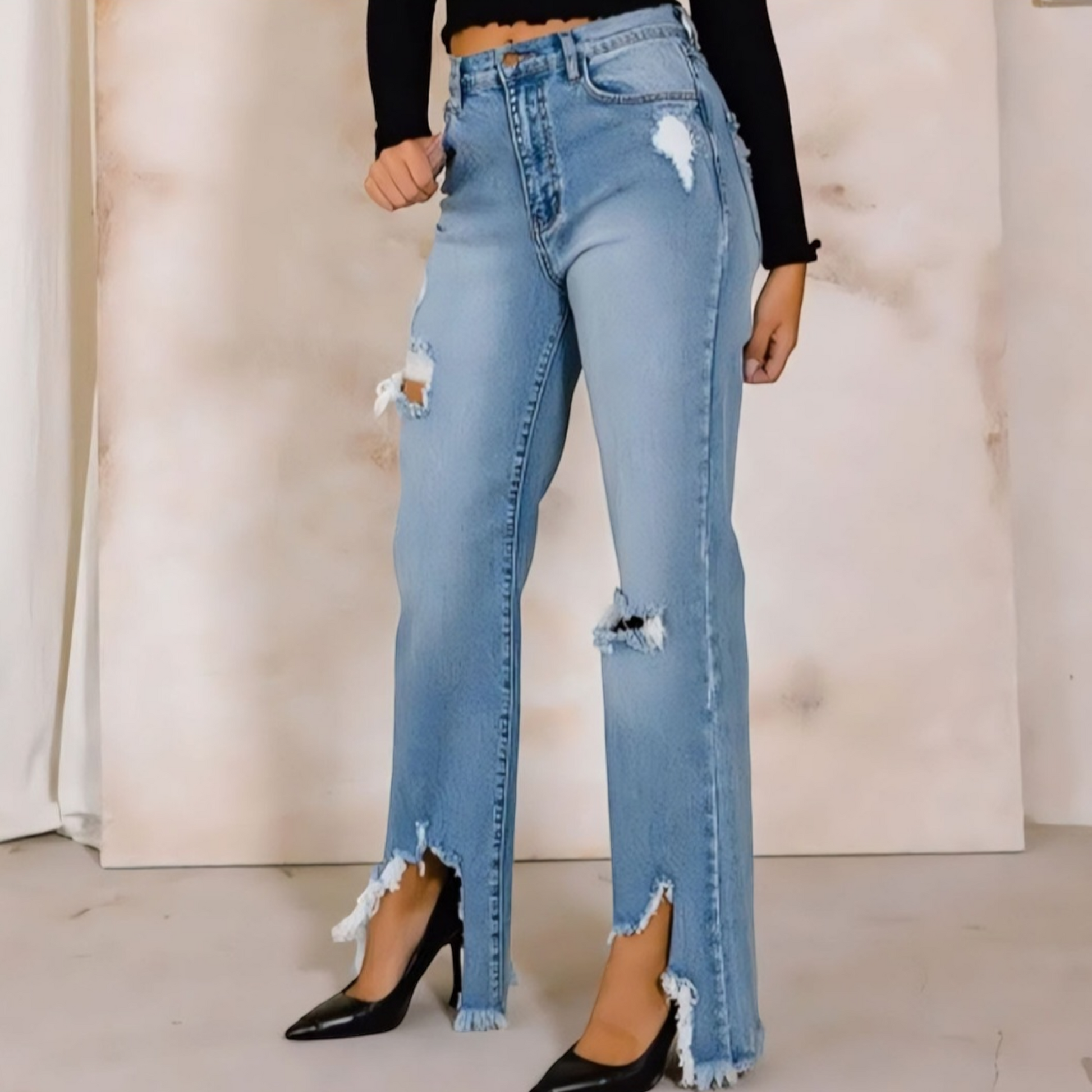 Elevate your denim collection with our High Rise Distressed Wide Jeans. Get the best of both worlds - comfort and style - with these flexible yet authentic denim pants. The high-rise design cinches at the waist for a flattering fit.