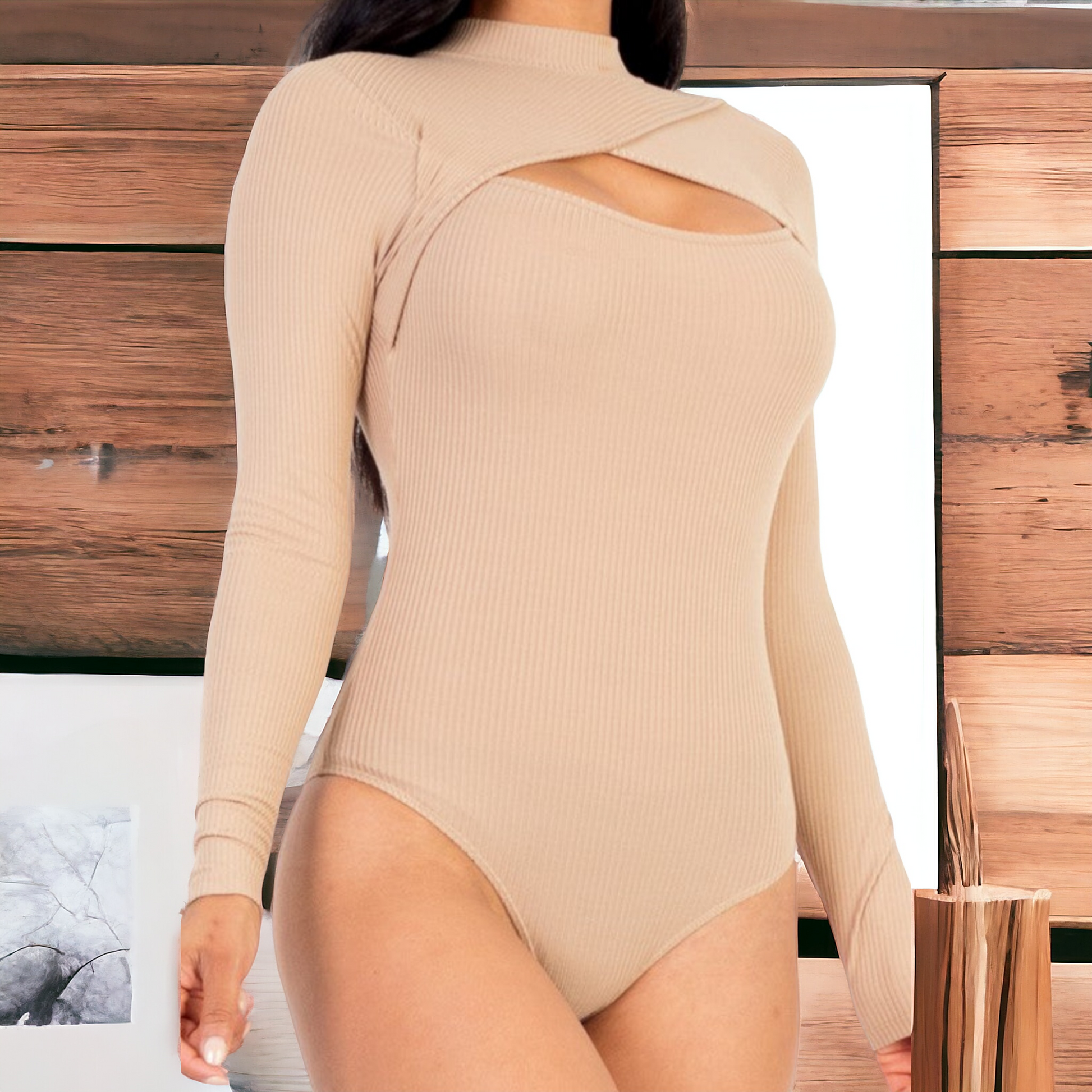 The JENNIFER BODYSUIT boasts a cutout front style, perfect for adding a touch of sexiness and allure to any outfit. Made with a soft and lightweight high stretch rib knit fabric, this long sleeve bodysuit is not only comfortable but also provides a perfect fit for every body type. Whether you're hitting the club, attending a party, or going on a date, this bodysuit is the ideal choice. In fact, 90% of customers highly recommend this style for its incredible stretchability and amazing fit.