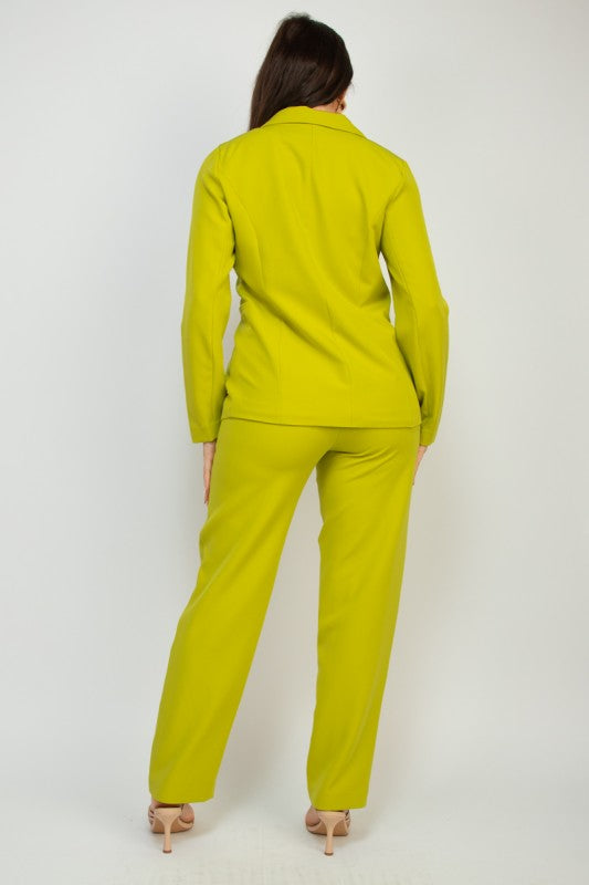 Woman wearing a bright green suit on a white background