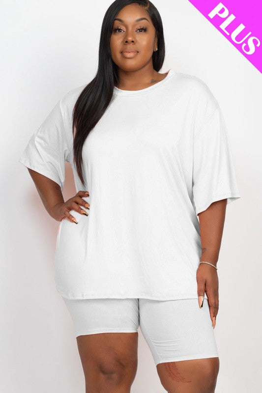 Woman wearing a white oversized t-shirt and shorts set on a white background with 'PLUS' text.