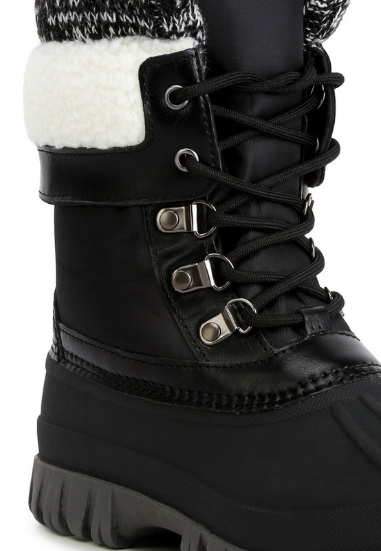 Crafted with a faux leather upper material, these boots feature a TPR outer sole and a closed rounded toe for lasting durability and endless comfort. The lace up closure allows for a secure fit while the knitted collar adds a touch of style. Designed with shearling lining detail and a lug sole, and finished with lightly cushioned insoles, these boots are perfect for any occasion. 