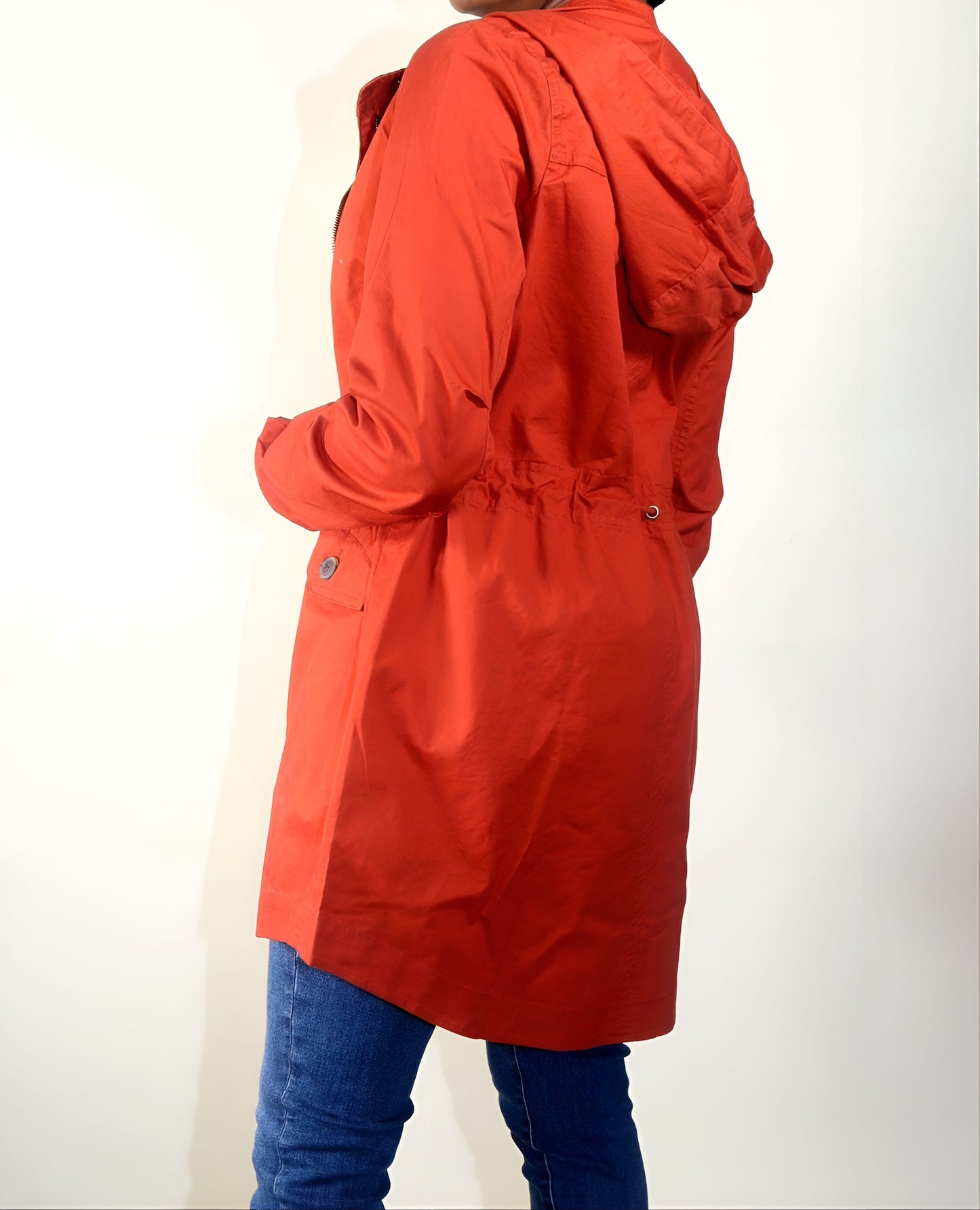 Rust Jacket/Coat Hooded Long line bodice Front zipper closure with snap button Adjustable waist drawstring for a snug fit Two front flap pockets Medium weight Durable cotton fabric  100% Cotton Color may vary due to lighting on image