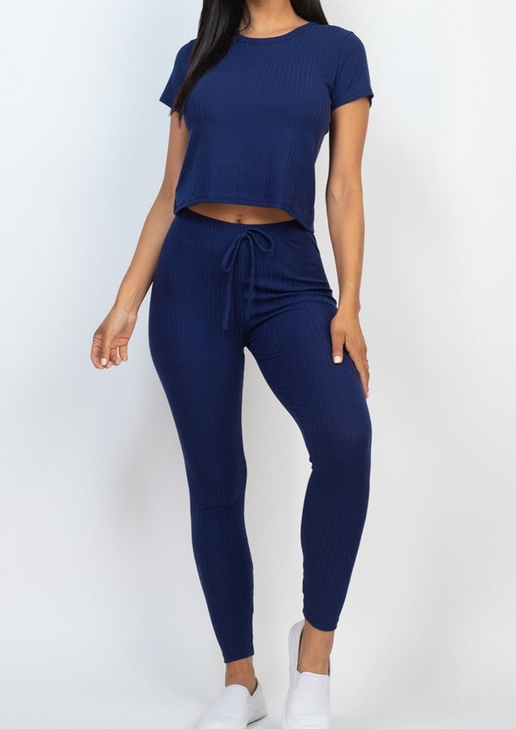 Indulge in the luxurious comfort of our navy lightweight stretch legging set. Crafted from a blend of 92% polyester and 8% spandex, this set features a short sleeve top and legging bottom perfect for loungewear. Elevate your lounge game with this elegant and comfortable set.